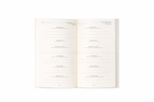 Inside page of The One Percent Journal showing a daily progress layout and motivational quote